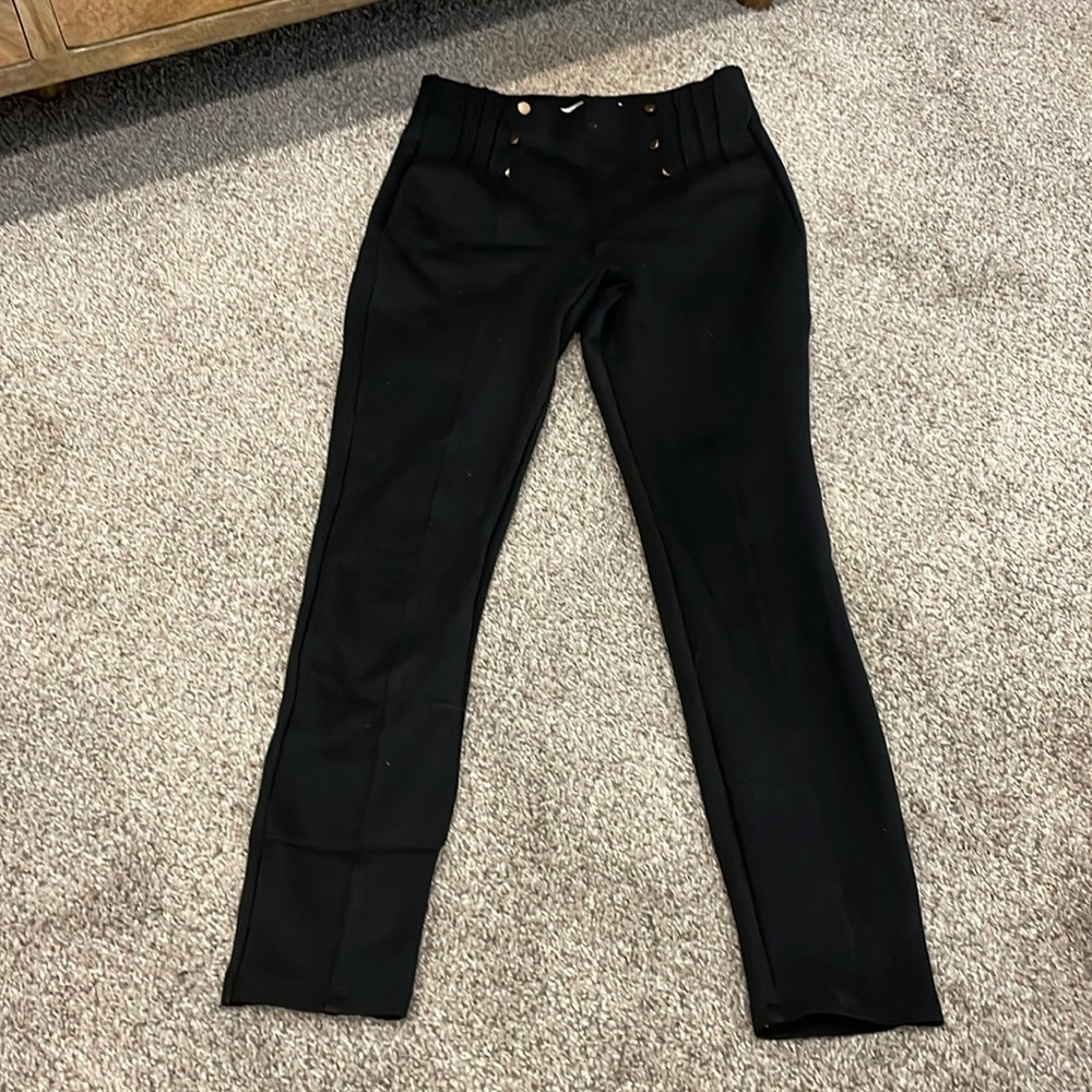 Black leggings with gold buttons